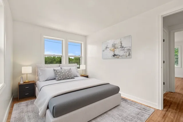 a bedroom with a bed and a couch