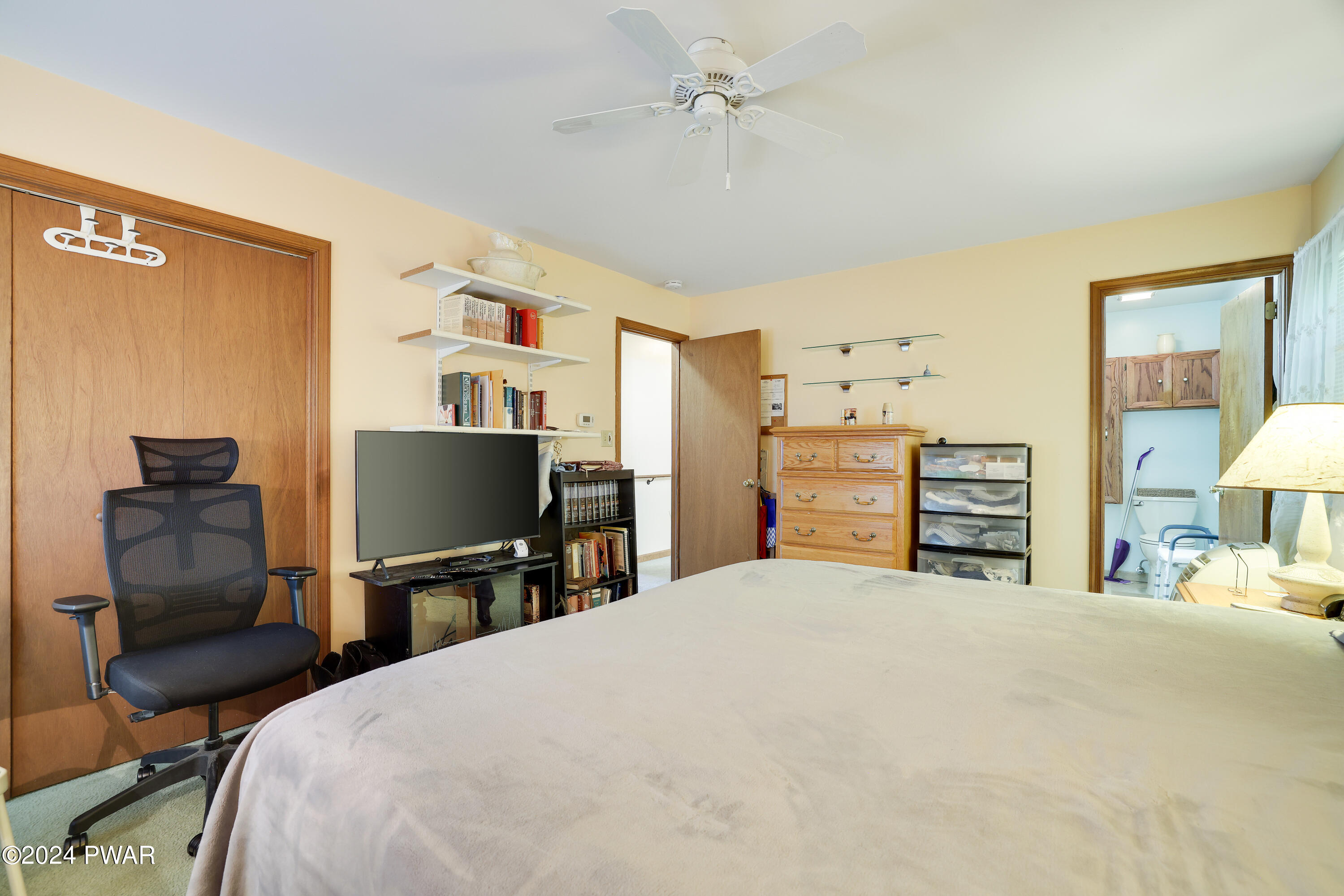 134 Magic Mountain Road Henryville, PA 18332 - Photo 36 of 62 a bedroom with a bed and furniture