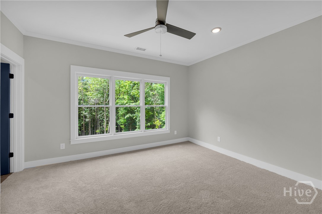2476 St Martin Way Monroe, GA 30656 - Photo 54 of 75 Spacious En Suite Bedroom featuring light gray walls, white trim, and light gray carpeting