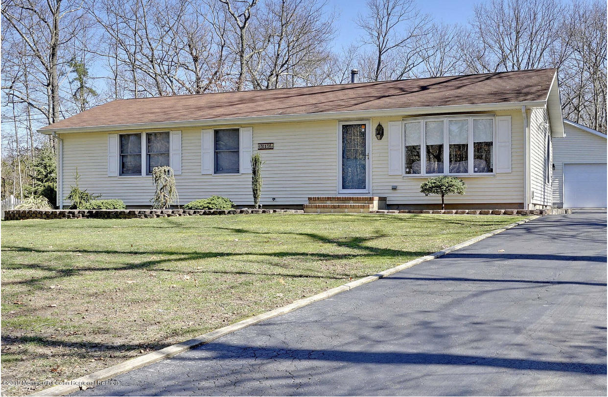 219 Jackson Pines Road Jackson, NJ 08527 - Photo 1 of 26 a view of a white house with a big yard and large trees