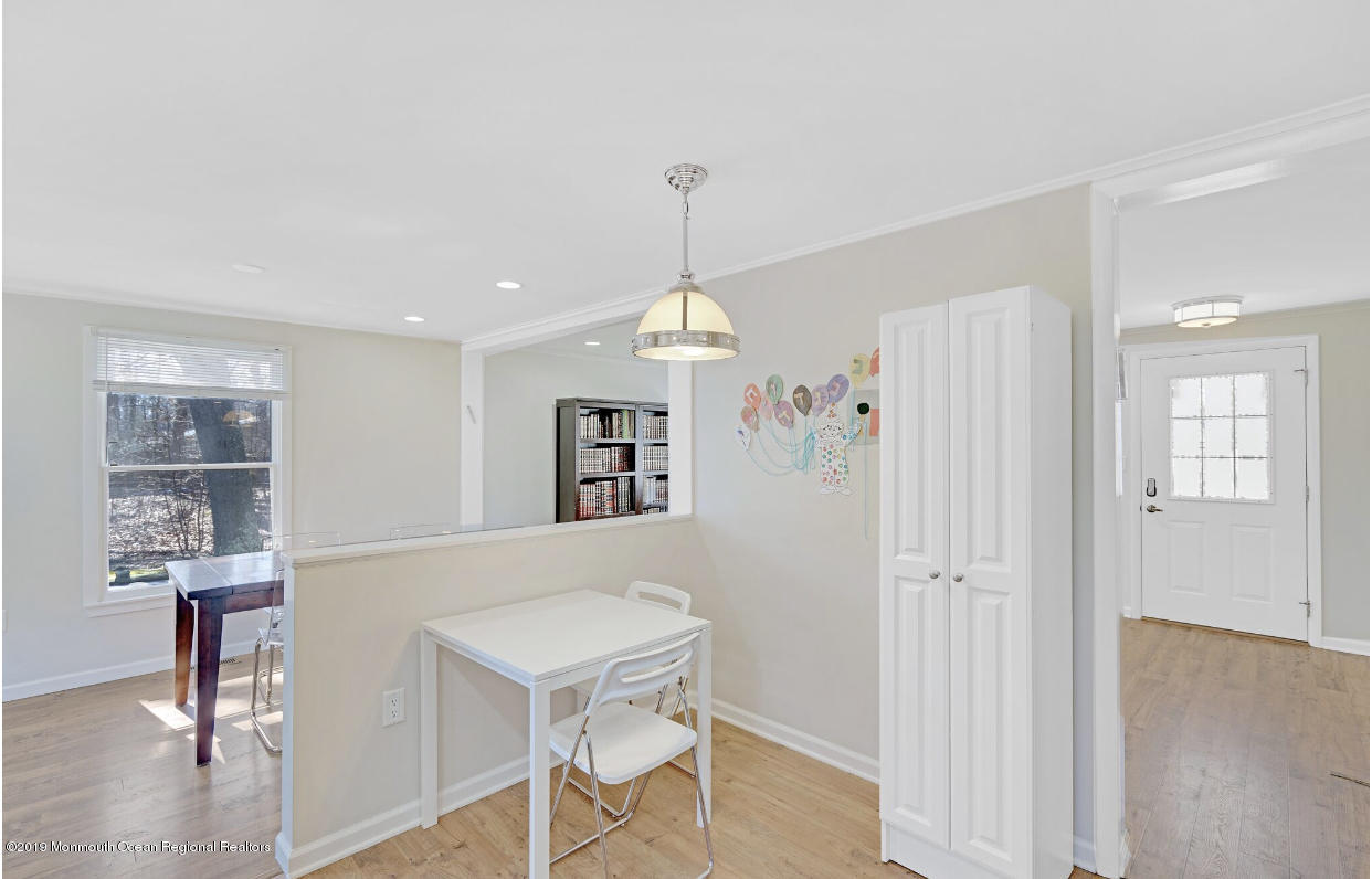 219 Jackson Pines Road Jackson, NJ 08527 - Photo 11 of 26 a view of a livingroom with furniture wooden floor and windows
