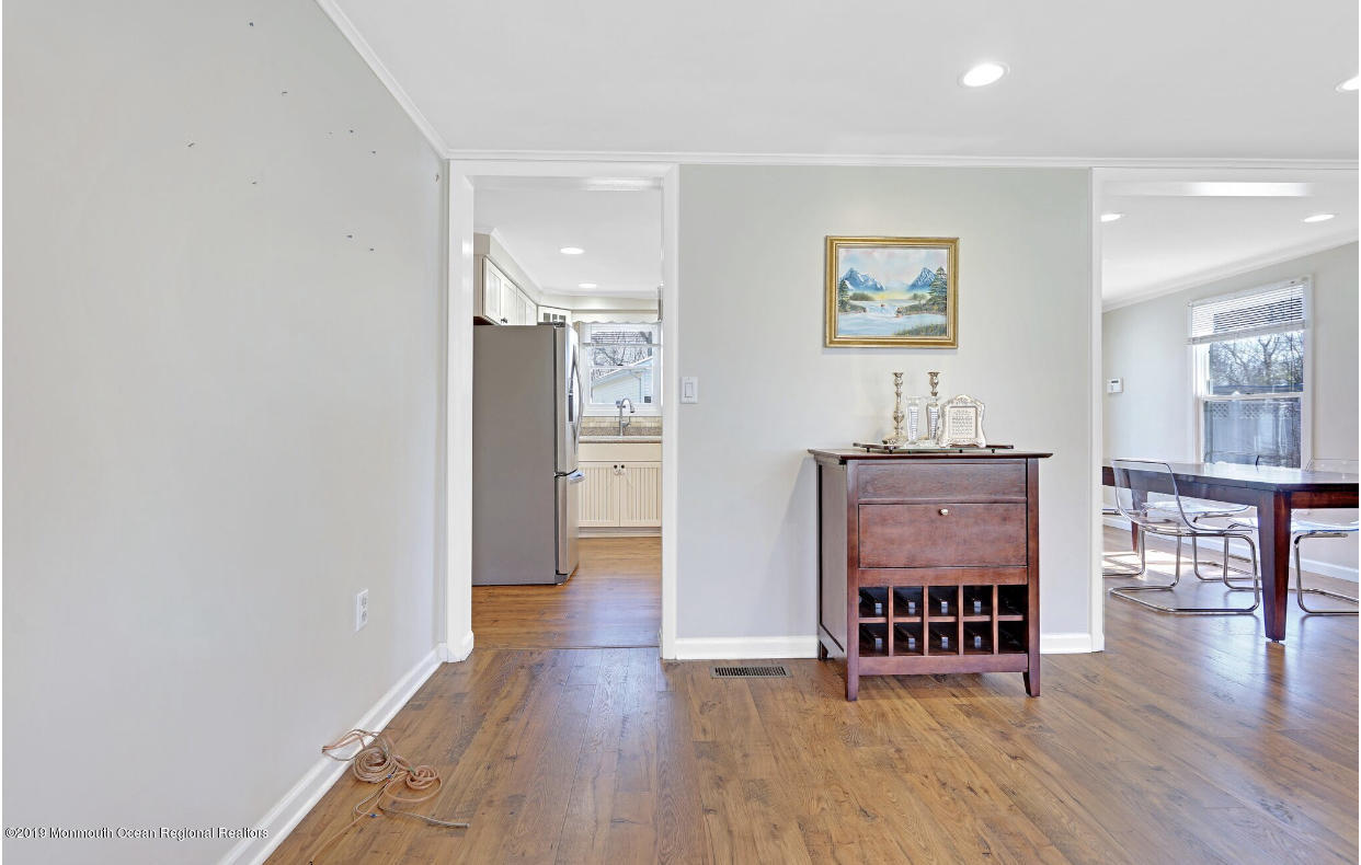 219 Jackson Pines Road Jackson, NJ 08527 - Photo 16 of 26 a dining room with furniture and wooden floor