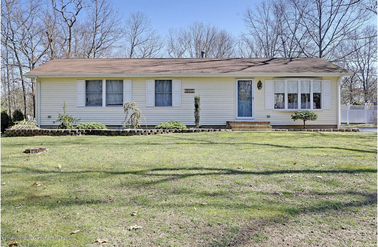 219 Jackson Pines Road Jackson, NJ 08527 - Photo 2 of 26 a front view of a house with a yard