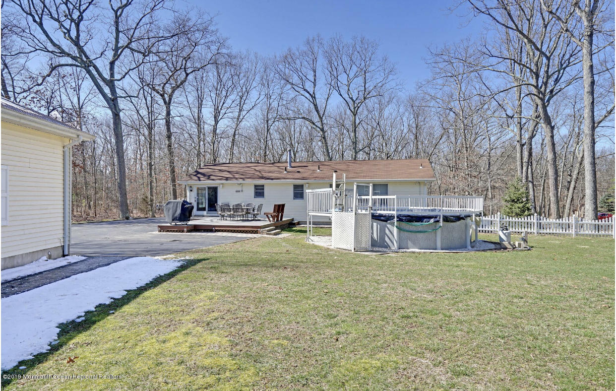 219 Jackson Pines Road Jackson, NJ 08527 - Photo 25 of 26 a view of a house with swimming pool and sitting area