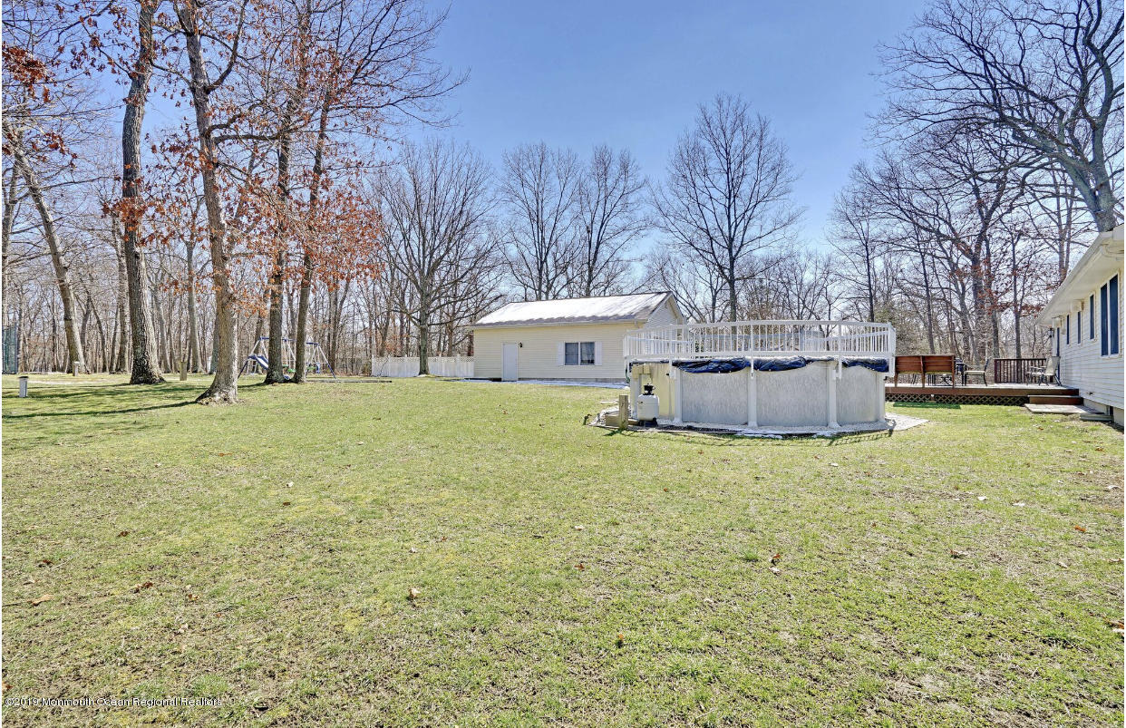 219 Jackson Pines Road Jackson, NJ 08527 - Photo 26 of 26 a white house that has a big yard