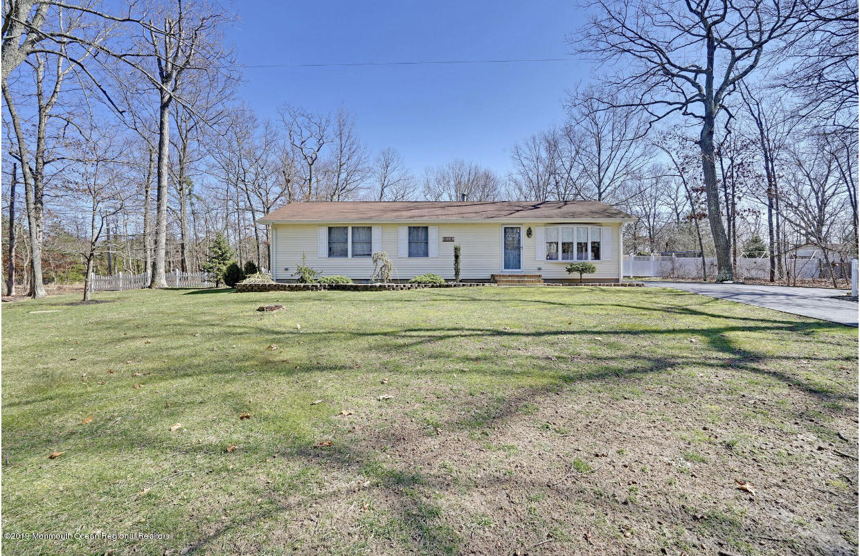 219 Jackson Pines Road Jackson, NJ 08527 - Photo 4 of 26 a view of a house with a big yard and large trees