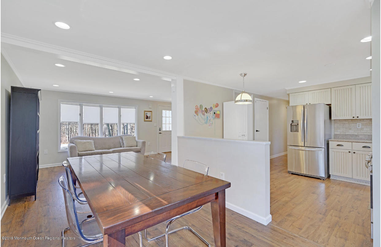 219 Jackson Pines Road Jackson, NJ 08527 - Photo 8 of 26 a view of a dining room with furniture and wooden floor
