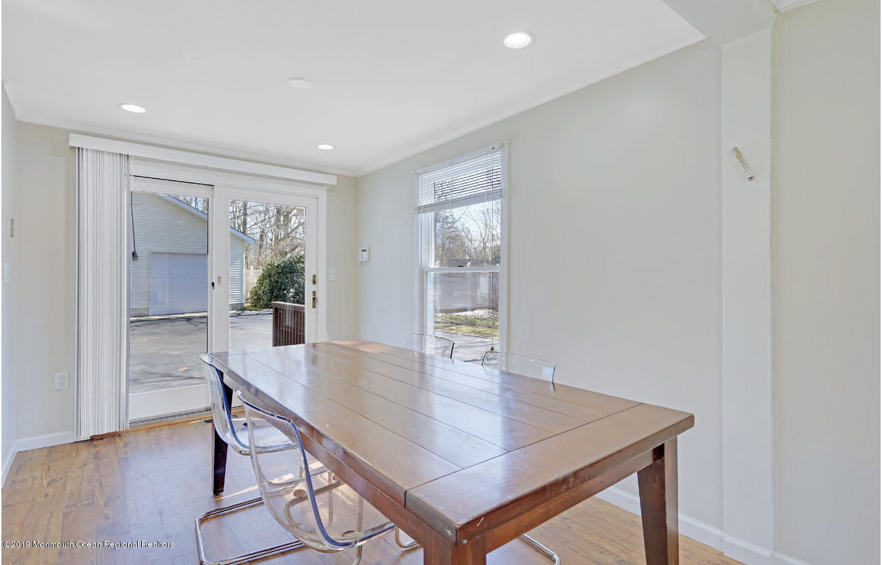 219 Jackson Pines Road Jackson, NJ 08527 - Photo 9 of 26 a view of a dining room with furniture and wooden floor