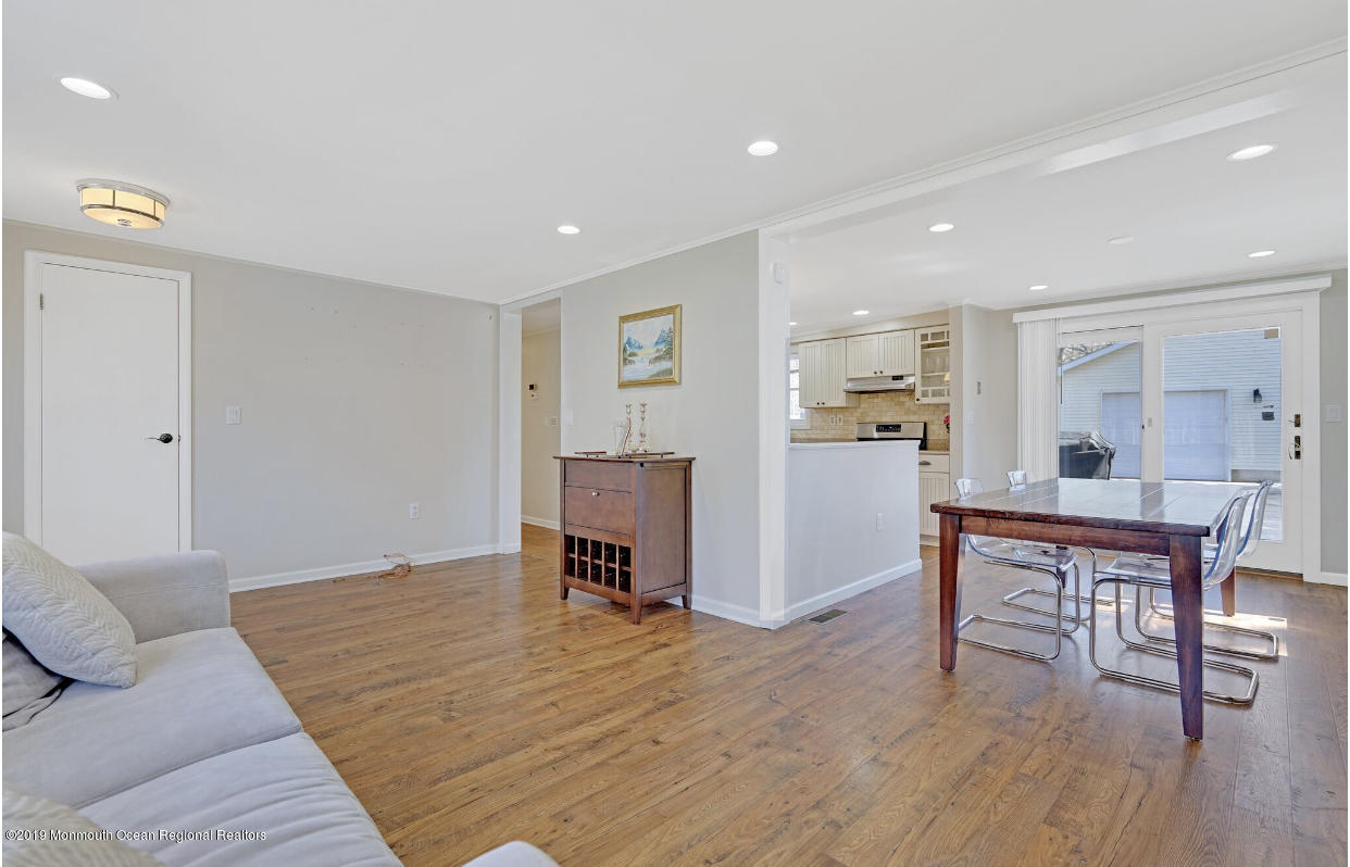 219 Jackson Pines Road Jackson, NJ 08527 - Photo 10 of 26 a living room with furniture and a wooden floor