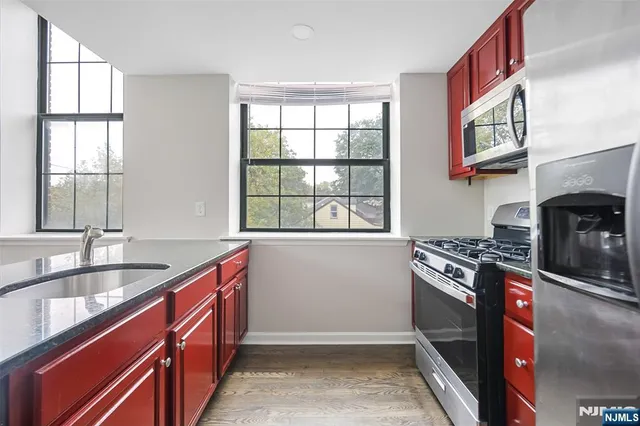 a kitchen that has a sink and a stove