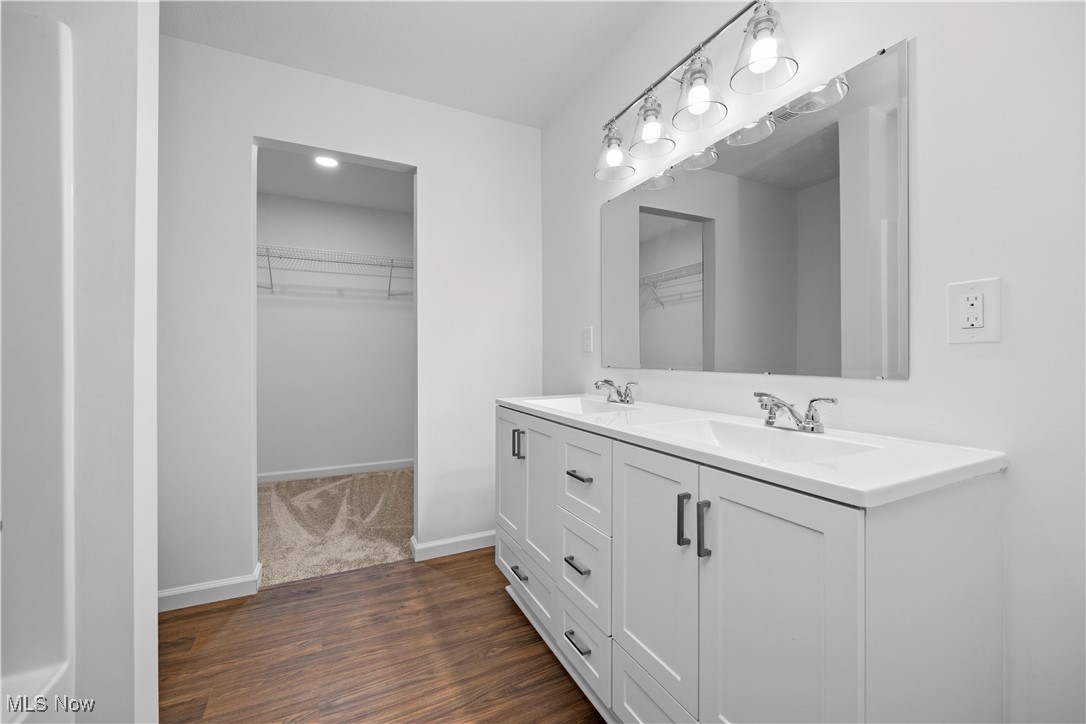 1996 East Oldgate Road Sandusky, OH 44870 - Photo 21 of 38 Bathroom with hardwood / wood-style flooring and vanity. Master Builder Interior Photo