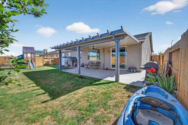 a view of a backyard with patio