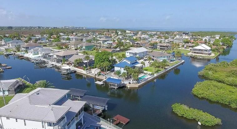 7313 Hatteras Drive Hudson, FL 34667 - Photo 14 of 33 an aerial view of residential houses with outdoor space
