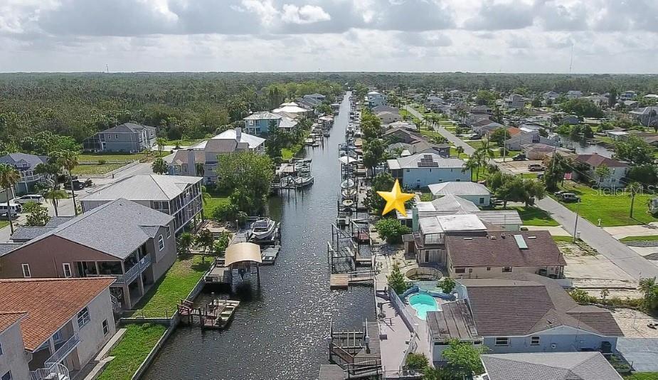 7313 Hatteras Drive Hudson, FL 34667 - Photo 17 of 33 an aerial view of a city with lots of residential buildings