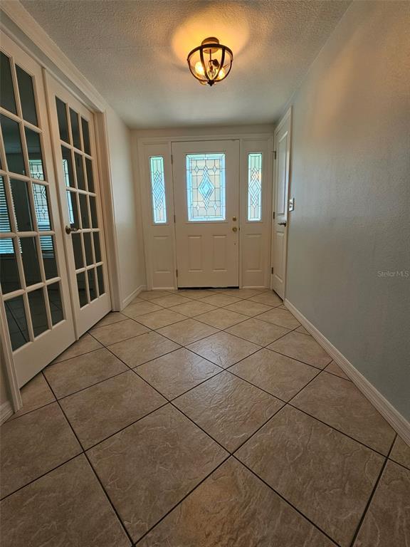 7313 Hatteras Drive Hudson, FL 34667 - Photo 2 of 33 an empty room with windows