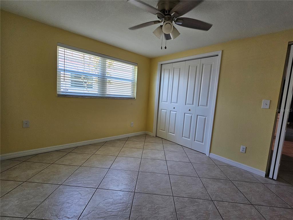 7313 Hatteras Drive Hudson, FL 34667 - Photo 24 of 33 a view of an empty room with a window
