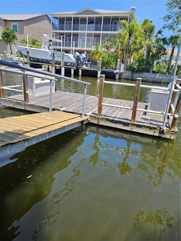 7313 Hatteras Drive Hudson, FL 34667 - Photo 26 of 33 a small swimming pool is sitting in the water
