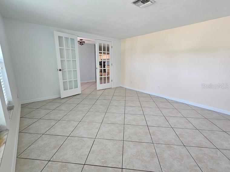 7313 Hatteras Drive Hudson, FL 34667 - Photo 9 of 33 a view of an empty room with a window