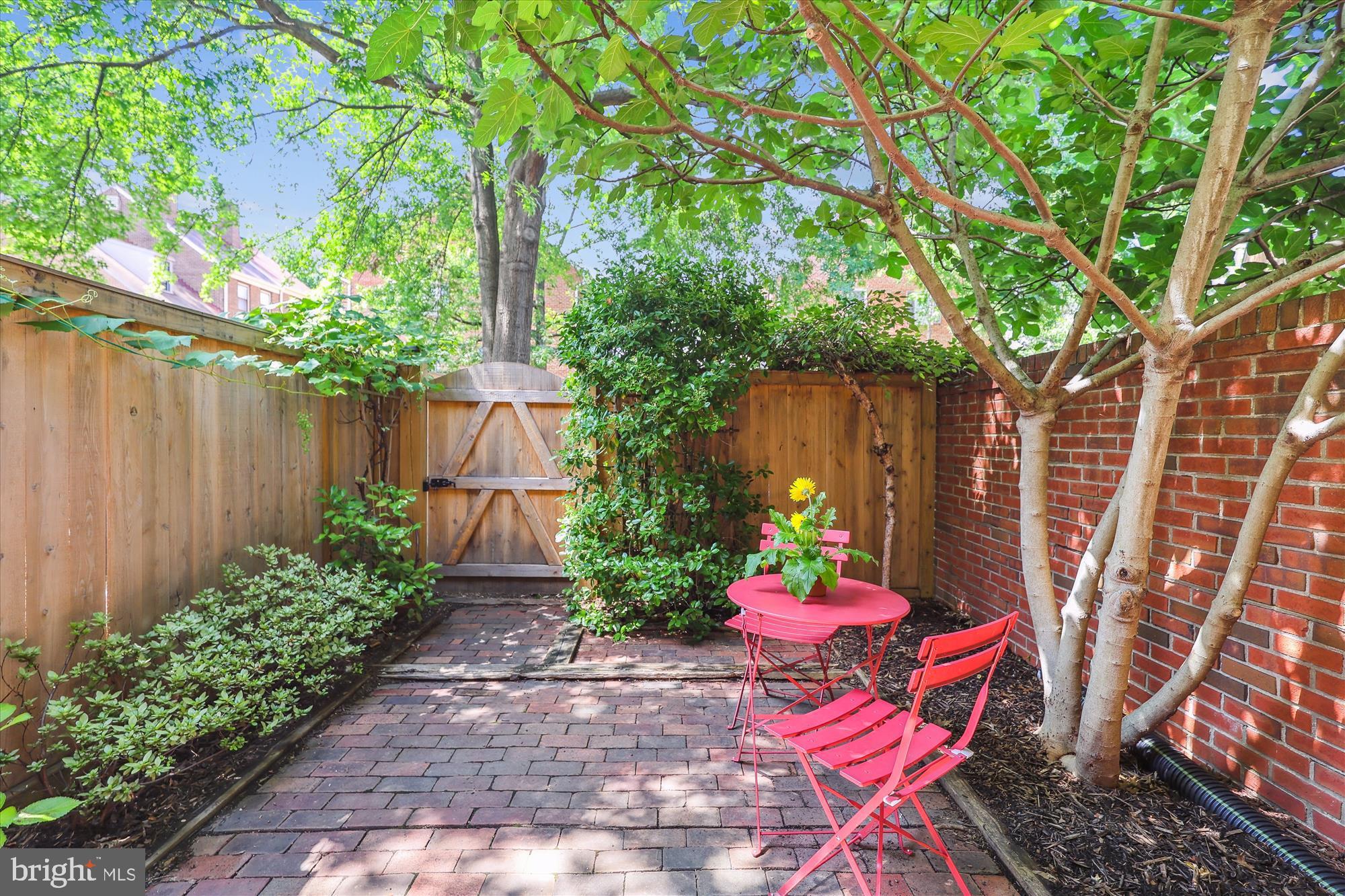 1229 Portner Road Alexandria, VA 22314 - Photo 3 of 47 a wooden bench sitting in front of a house