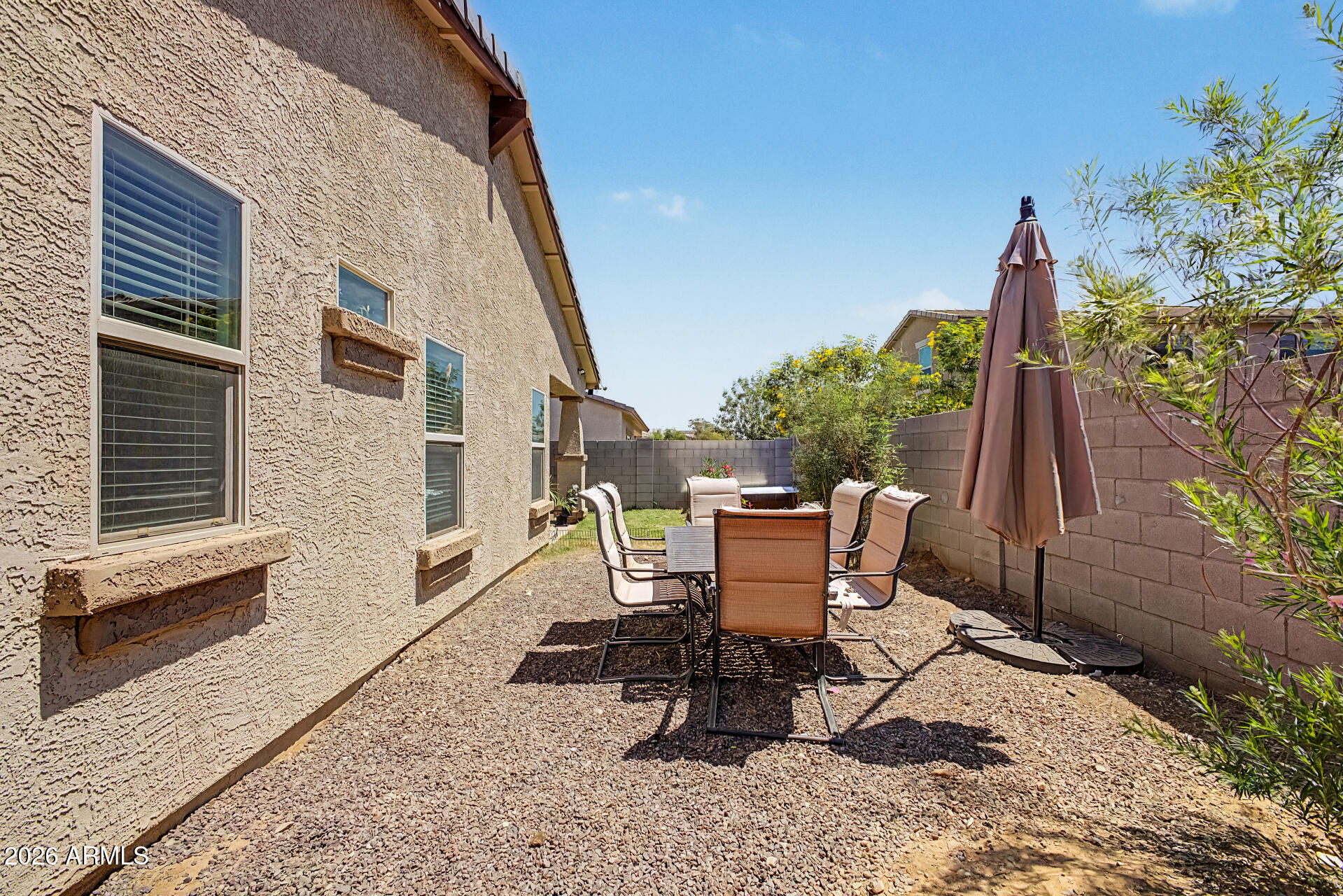16719 West Rowel Road Surprise, AZ 85387 - Photo 25 of 28 a view of a two chairs in the patio