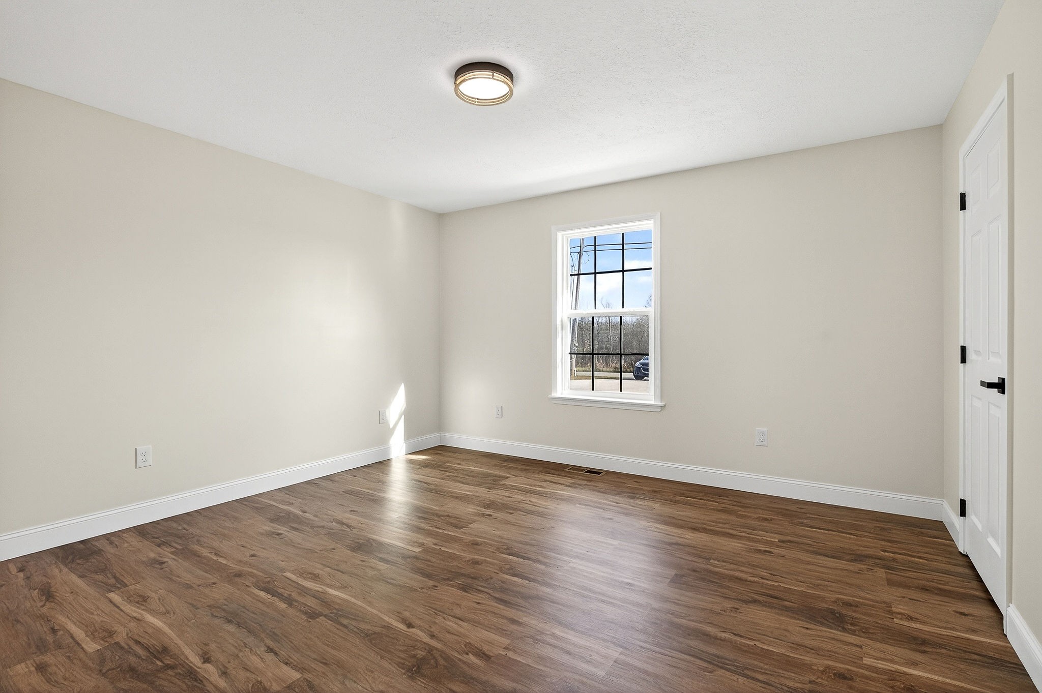 498 Low Gap Road Sparta, TN 38583 - Photo 24 of 38 an empty room with wooden floor and windows