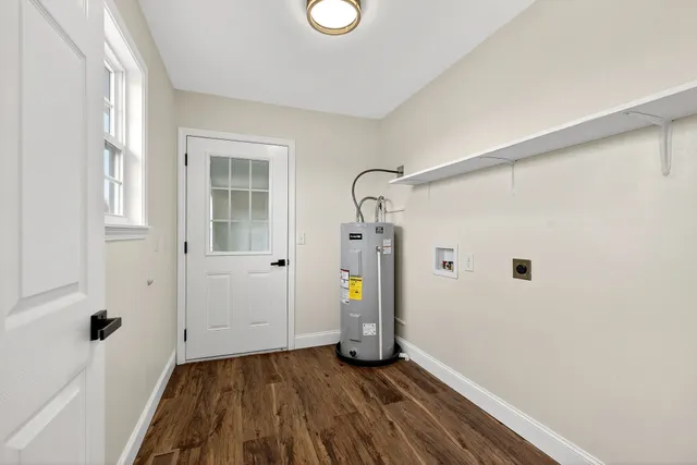 a view of hallway with wooden floor