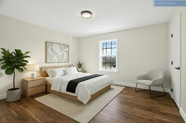 a view of a dining room with furniture and a rug