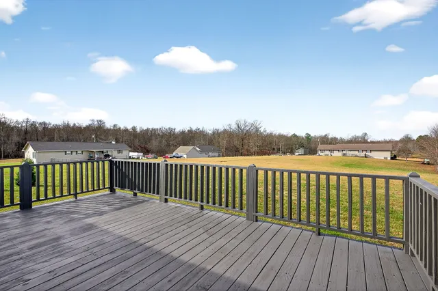a view of an ocean and a trees in the background