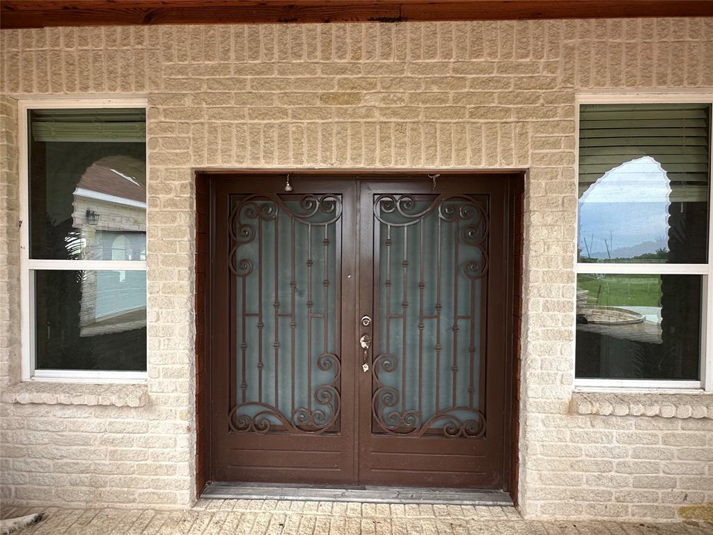 241 Gentry Road Ennis, TX 75119 - Photo 11 of 40 a view of a entryway door front of house