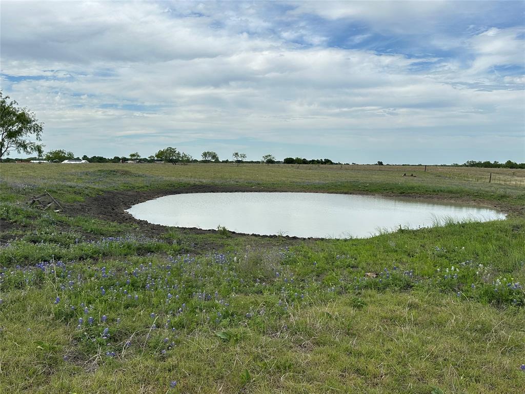 241 Gentry Road Ennis, TX 75119 - Photo 31 of 40 a view of a lake with houses in the back