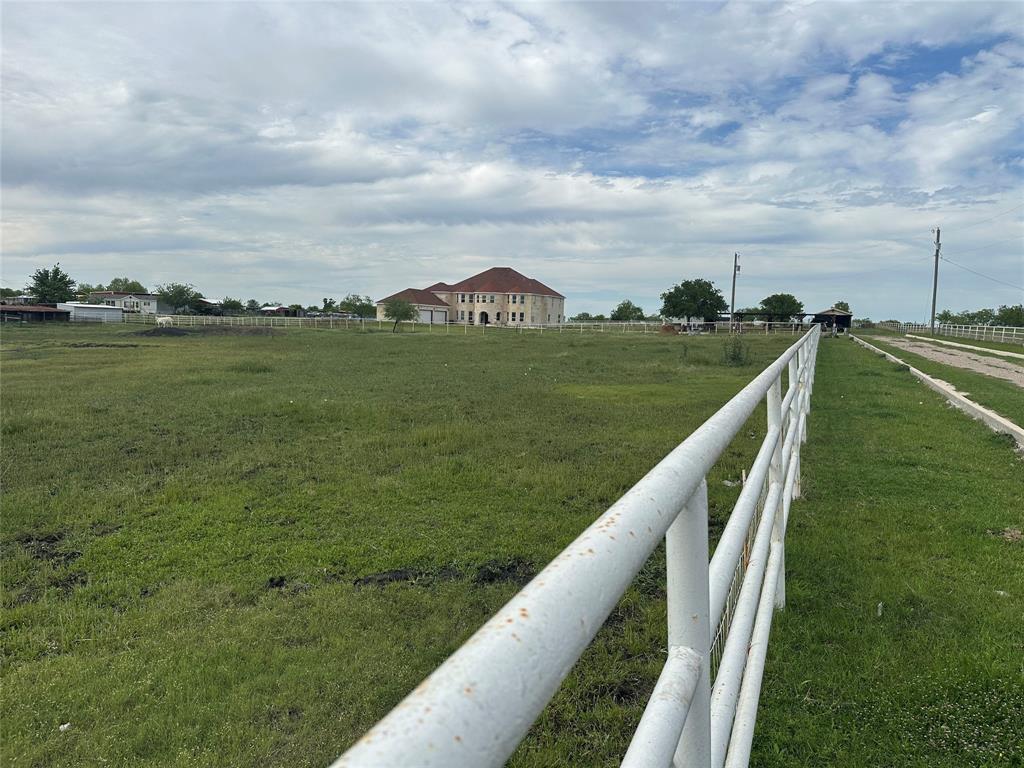 241 Gentry Road Ennis, TX 75119 - Photo 6 of 40 a view of a lake with a big yard