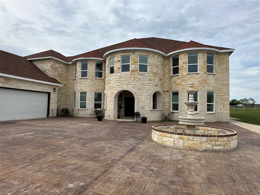 241 Gentry Road Ennis, TX 75119 - Photo 8 of 40 a front view of a house with a yard
