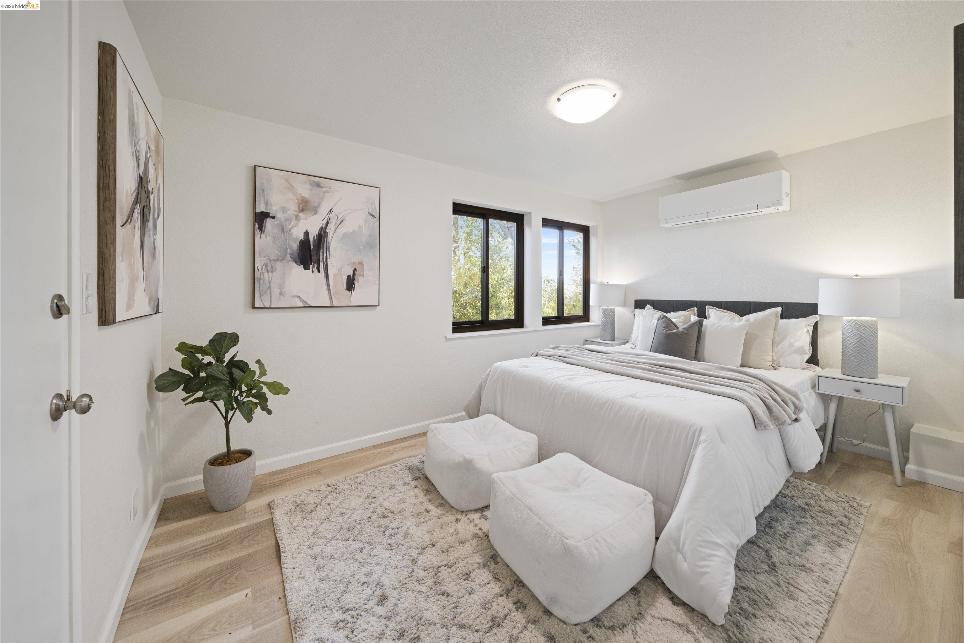 1170 Sterling Avenue Berkeley, CA 94708 - Photo 40 of 52 Bedroom with a wall mounted mini split and light wood finished floors
