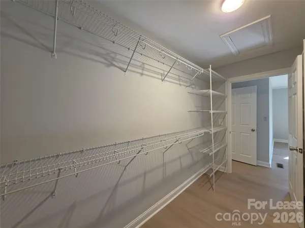 a view of a room with racks on the wall