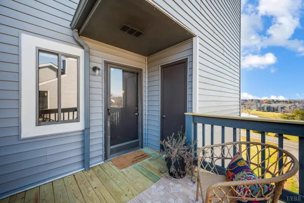 a view of a balcony with furniture