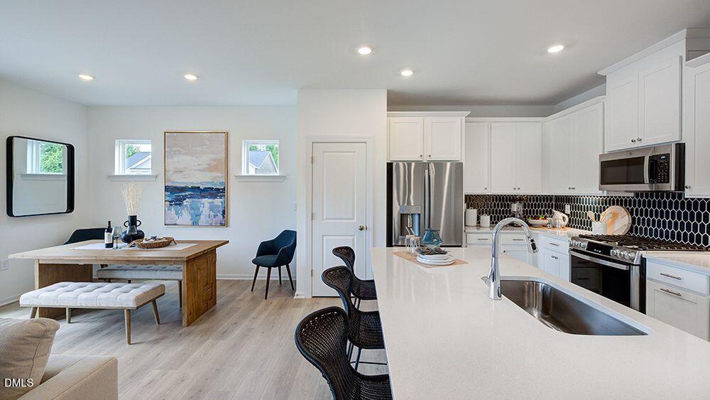 323 Sweetbay Tree Drive Wendell, NC 27591 - Photo 28 of 33 Floorplan Magnolia Kitchen casual dining