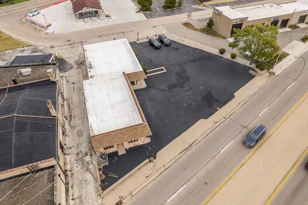 an aerial view of residential houses with outdoor space