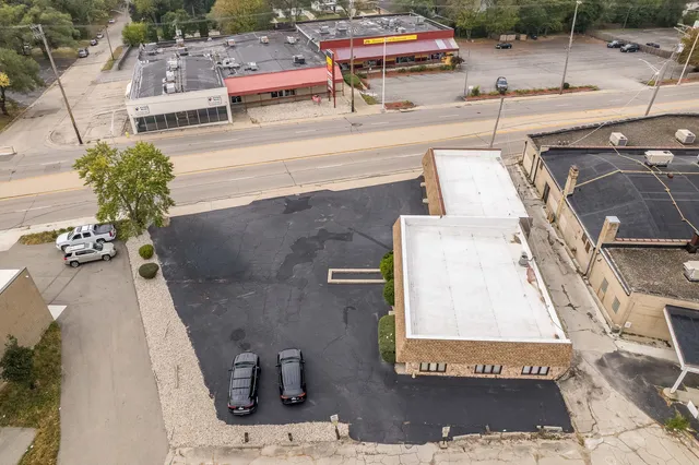 an aerial view of a house with a garden