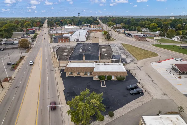 an aerial view of residential houses with outdoor space