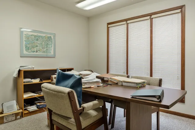 a view of a workspace with furniture