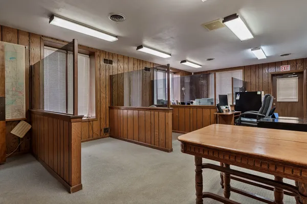 a kitchen with refrigerator and window