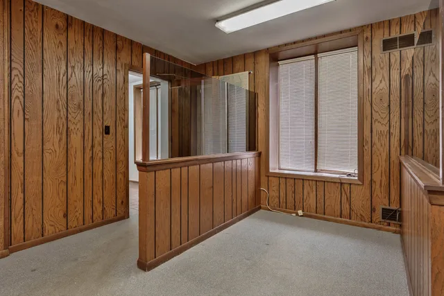 a view of a hallway with windows