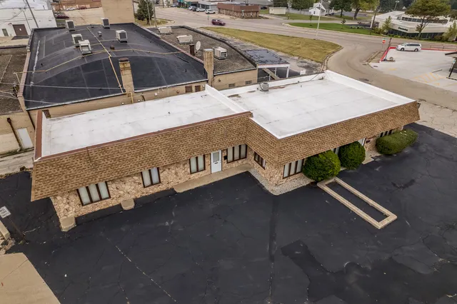 a view of a street with sitting area
