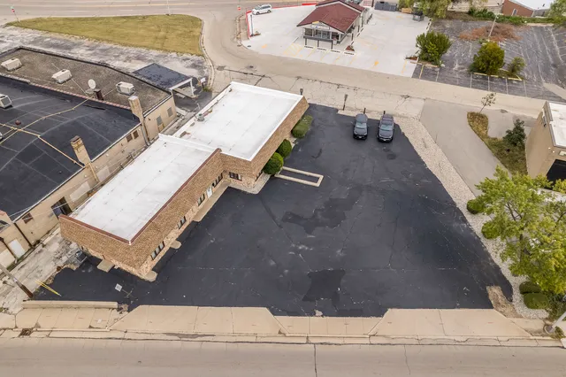 an aerial view of a house with outdoor space