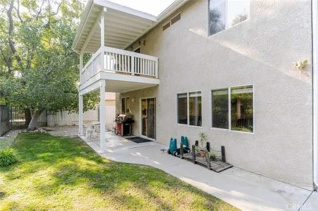 a view of yard with swimming pool and green space