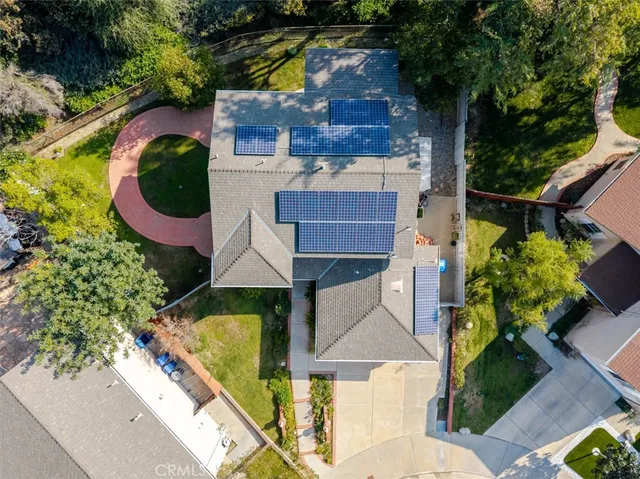 an aerial view of residential house with outdoor space and swimming pool