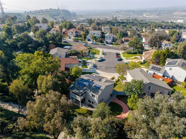 an aerial view of a house with a lake view
