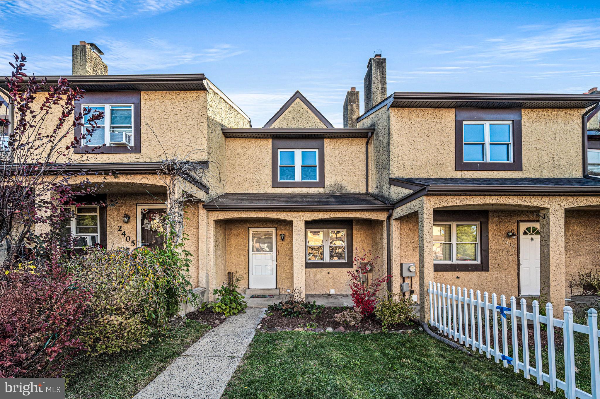 2404 Walnut Ridge Drive Pottstown, PA 19464 - Photo 1 of 24 a front view of a house with yard and porch