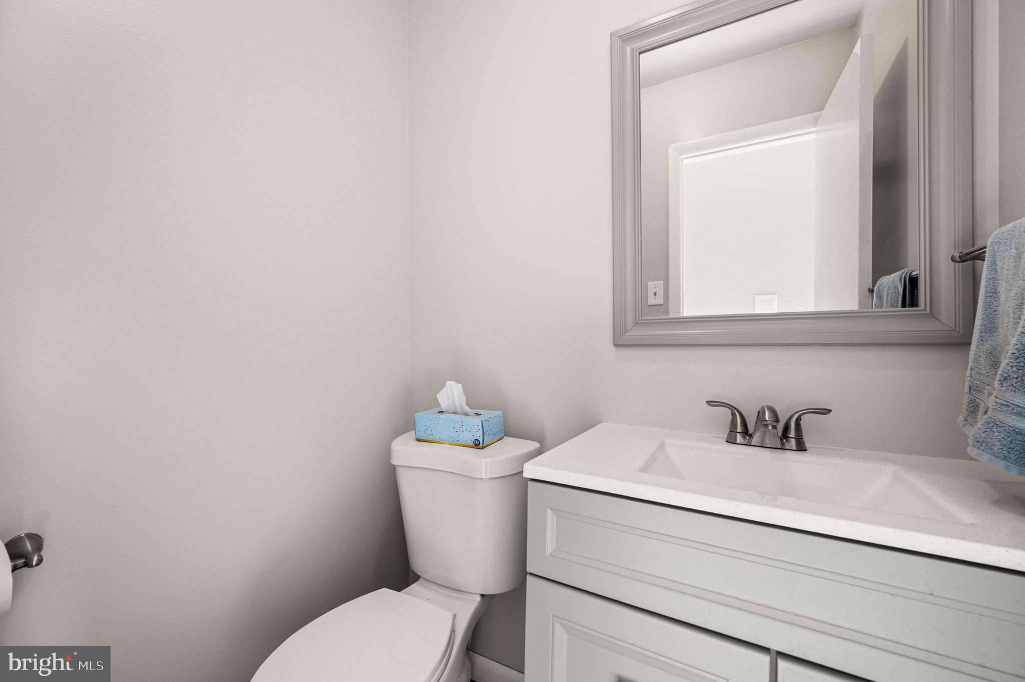 2404 Walnut Ridge Drive Pottstown, PA 19464 - Photo 12 of 24 a bathroom with a toilet sink and mirror