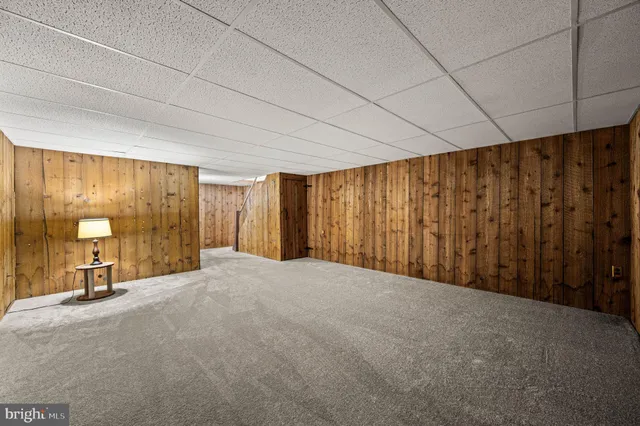 a view of balcony with wooden floor and fence